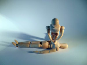 Insurance for first aid trainers - Shows a doll giving CPR