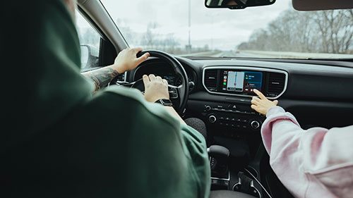 Renault car with woman touching the touchscreen