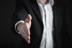 insurance company fraud handshake
