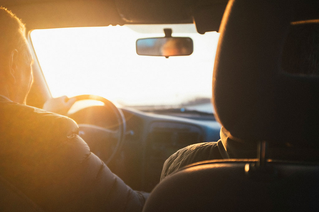 Man in a car driving