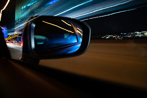 Cars wing mirror at night