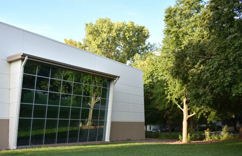 Reduce your business energy bill - Shows a business building with a garden area