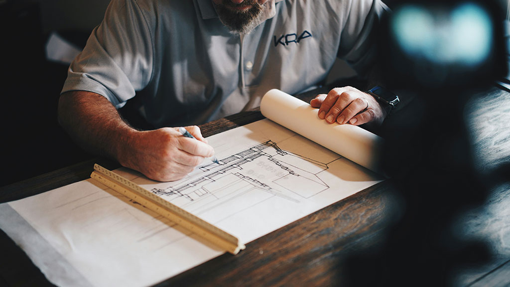 Man drawing a building