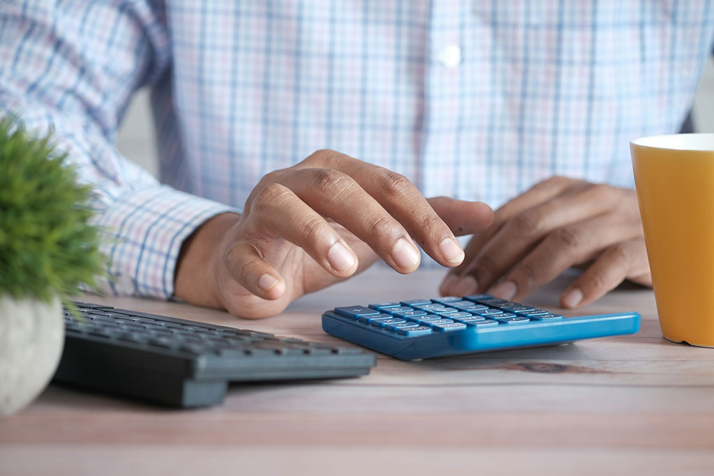 Man on a calculator