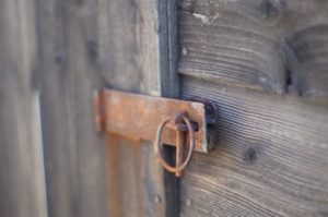 Shows a lock on a shed door