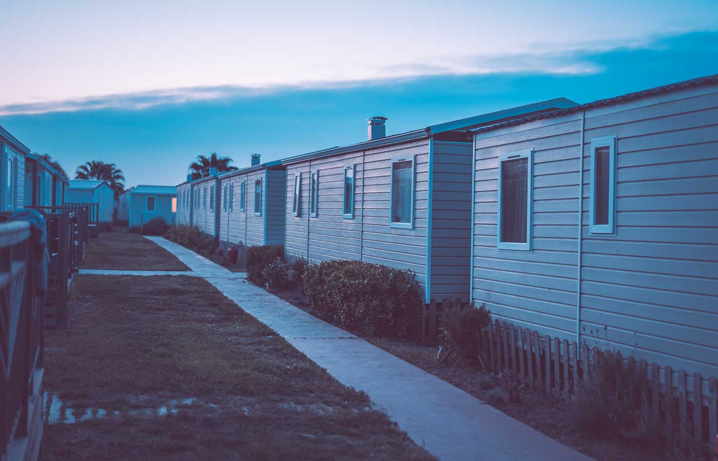 Shows a selection of Park Homes at sunset