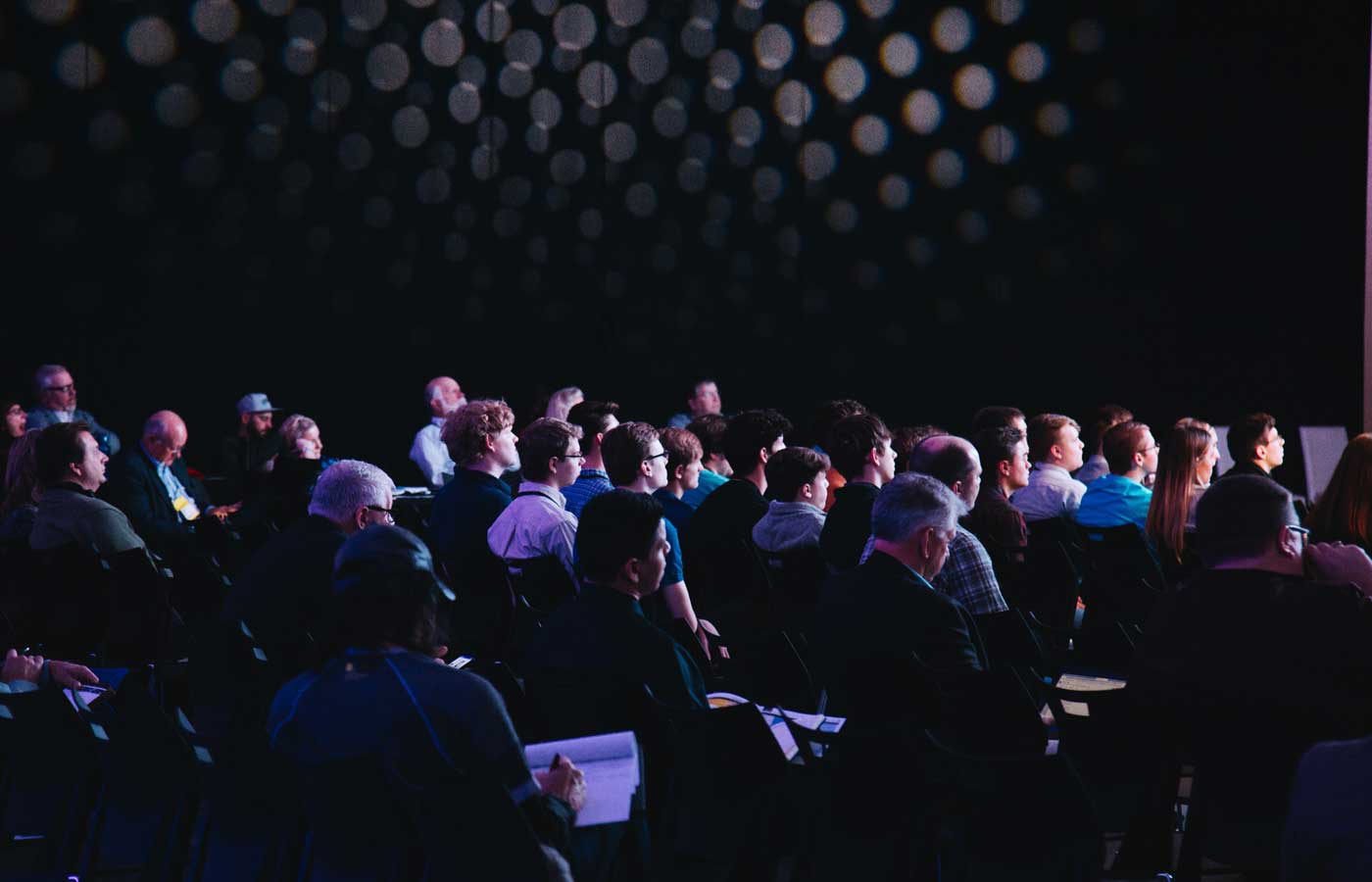 Planning a corporate event - Shows an audience watching a seminar