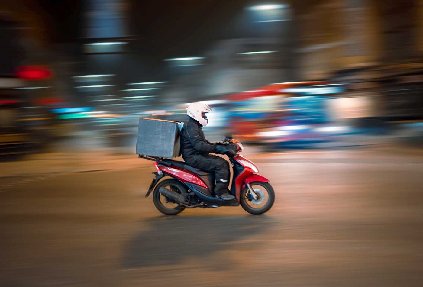 How to start a delivery business - Shows a courier on a motorcycle