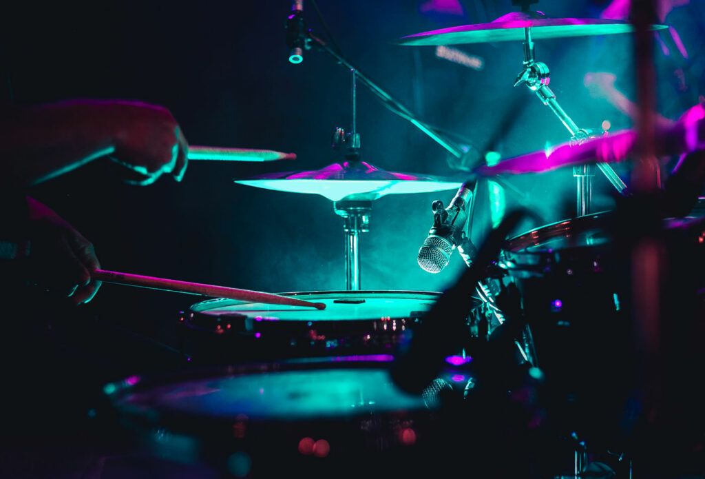 shows an image of a drum kit on stage