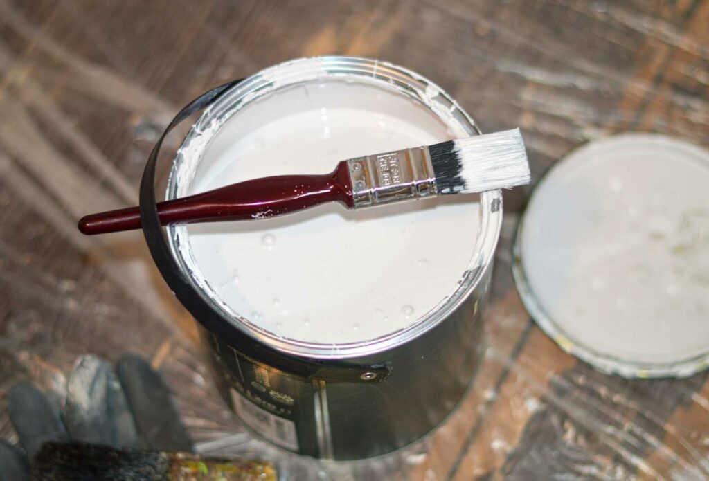 shows an image of a white pot of paint - painter and decorator insurance