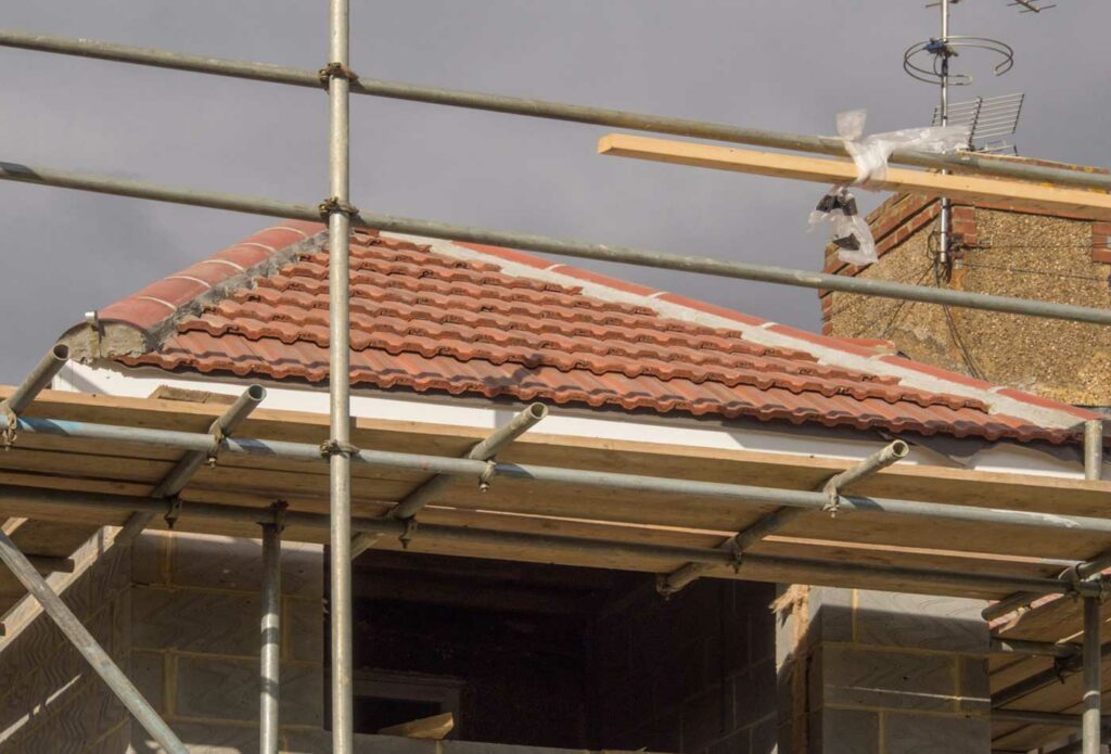 shows scaffolding around a house - construction insurance