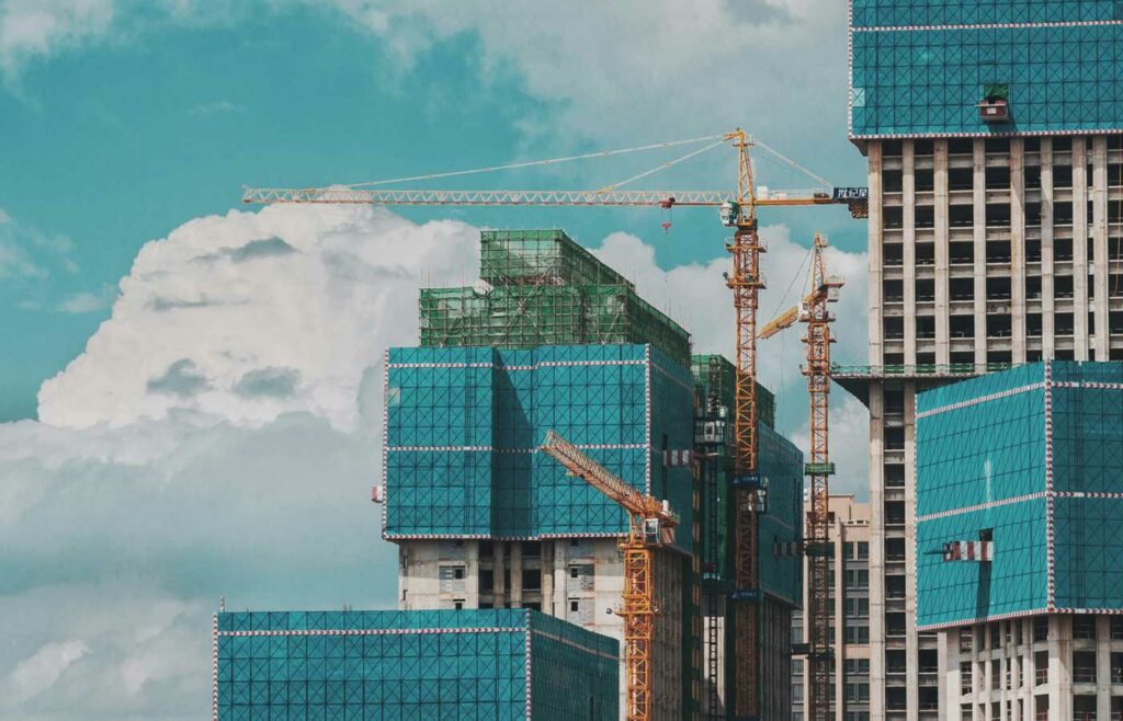 shows a large crane over a building
