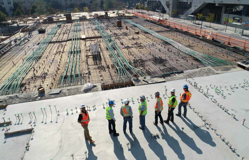 shows construction workers standing in a line