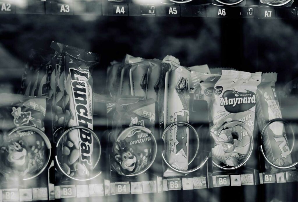 shows a close up of snacks in a vending machine - how to start a vending machine business