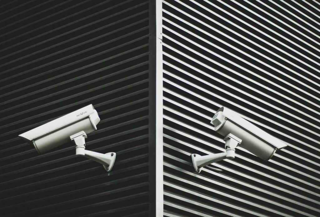shows two large security cameras 
