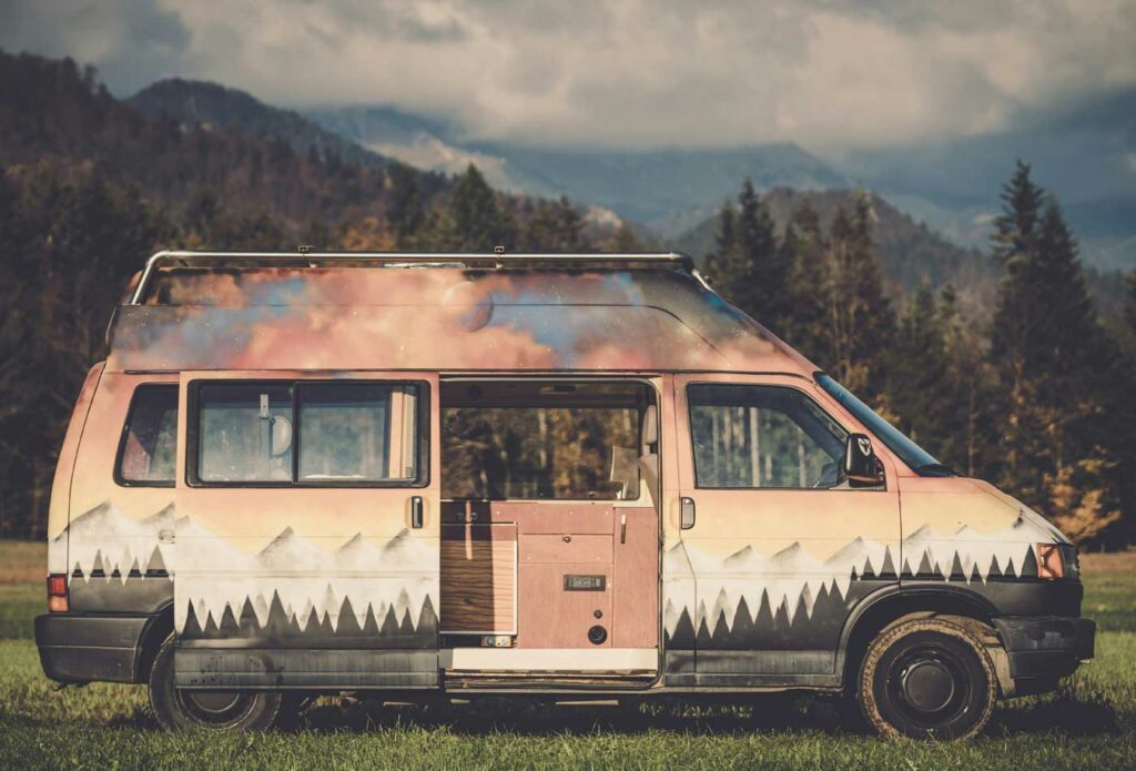 shows a converted campervan in the woods 
