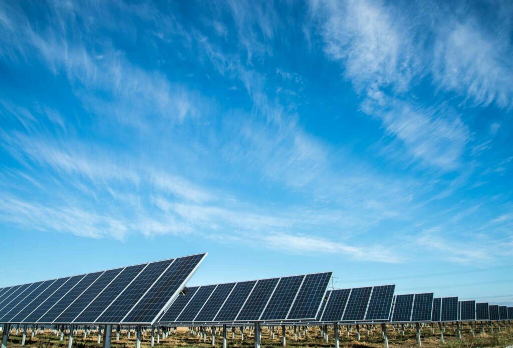 shows solar panels and a blue sky - solar power insurance