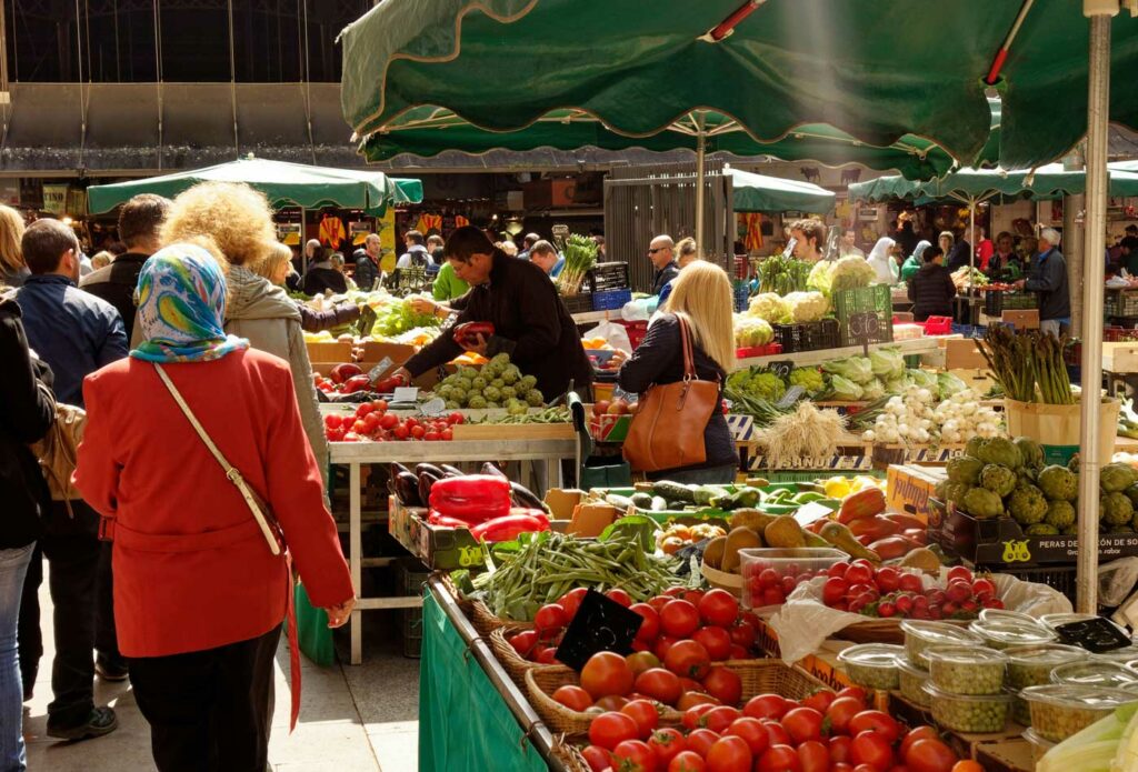 shows fruit and vegetable stalls at a market - market trader insurance 