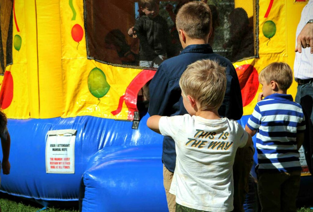 shows children playing on the bouncy castle - inflatable play equipment insurance