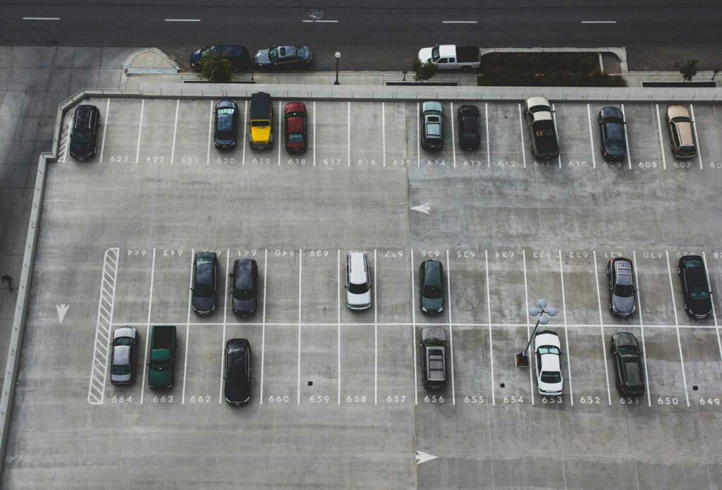 shows cars in a parking lot 