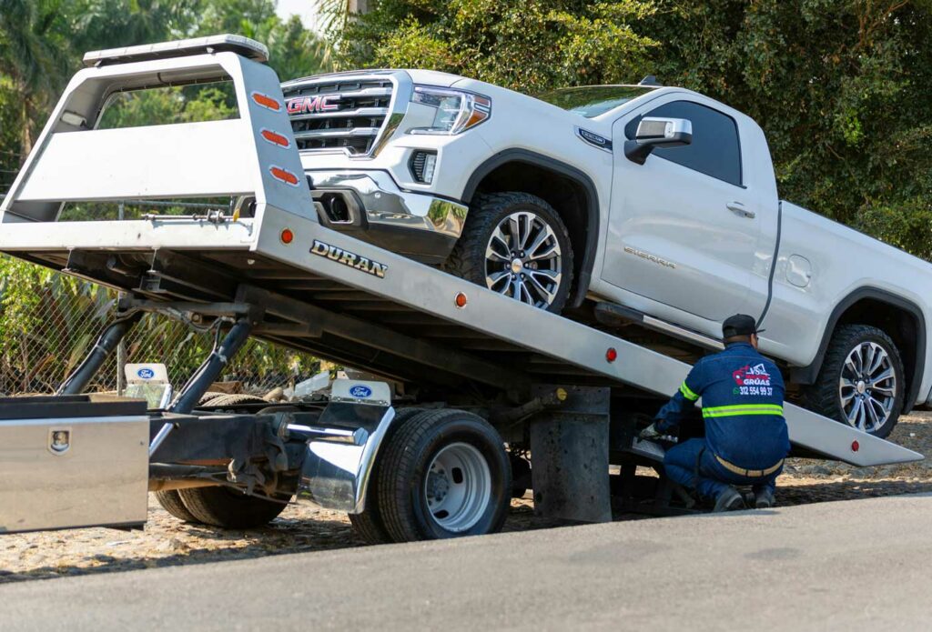 shows a large van being towed on the road