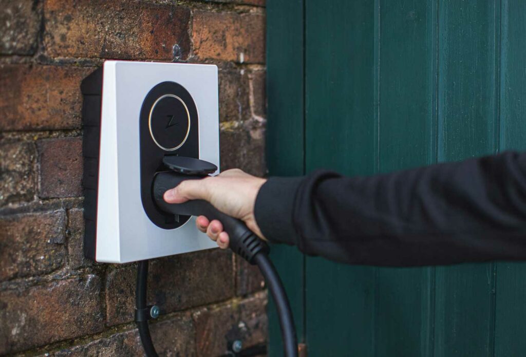 shows an electric car charging point - start a successful automotive business