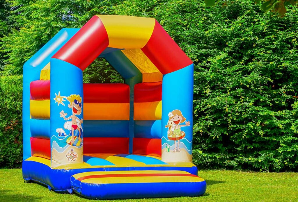 shows a bouncy castle in a garden 