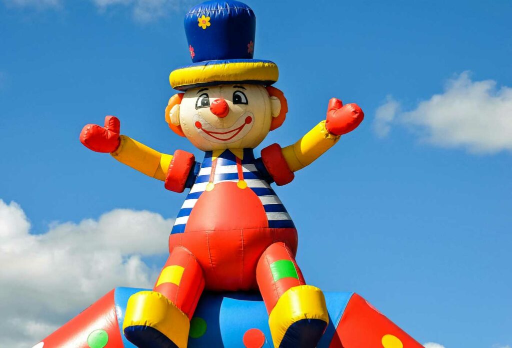 shows an inflatable clown - setting up a bouncy castle business in the UK 