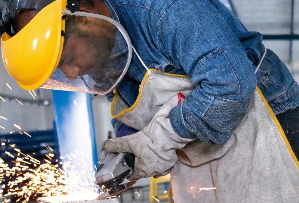 shows a man drilling - employers liability insurance