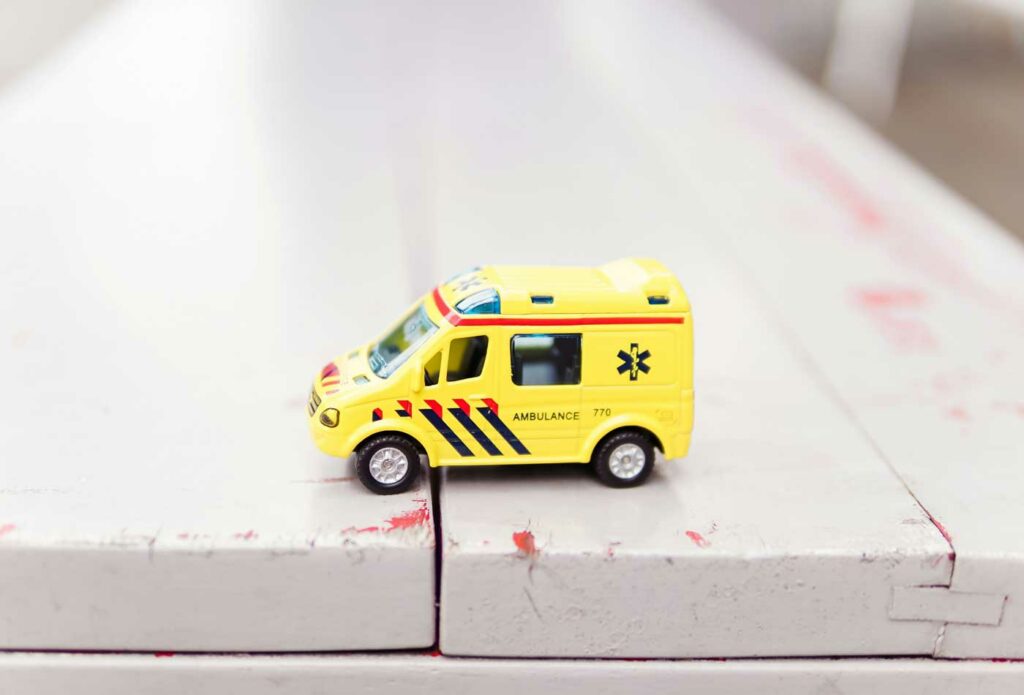 Shows a model ambulance - Public liability insurance guide