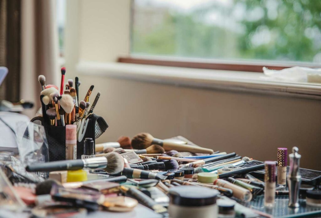 shows lots of makeup on a table - makeup artist insurance